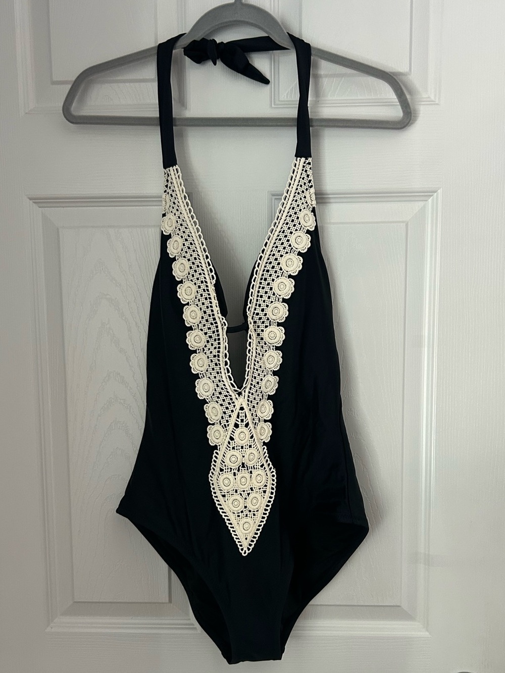 Kona Sol Black One-Piece Swimsuit with Cream Crochet Plunge